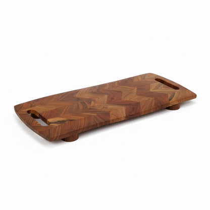 ACACIA WOOD 28" X 10" CHEVRON CUTTING BOARD WITH FEET
